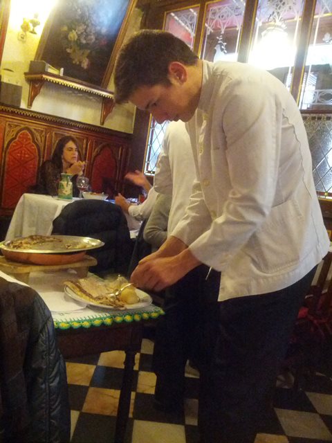 waiter deboning fish tableside - photo by Dean Curtis, 2014